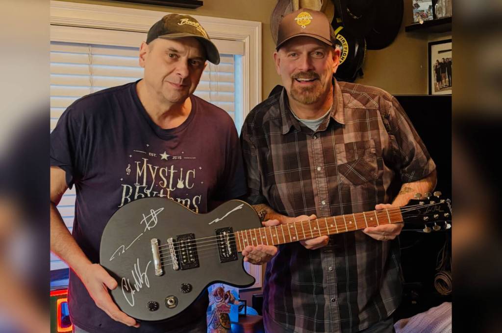 Nickelback donates signed guitar to Harrison benefit concert