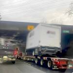 FILE - A truck mounted on a flatbed trailer failed to clear the railway bridge on Highway 1 through Langley on Dec. 20, 2024, the second such incident that month. A new overheight-detection system is coming to Chilliwack at the No. 3 Road in 2026 after six strikes since 2021. (Black Press file)